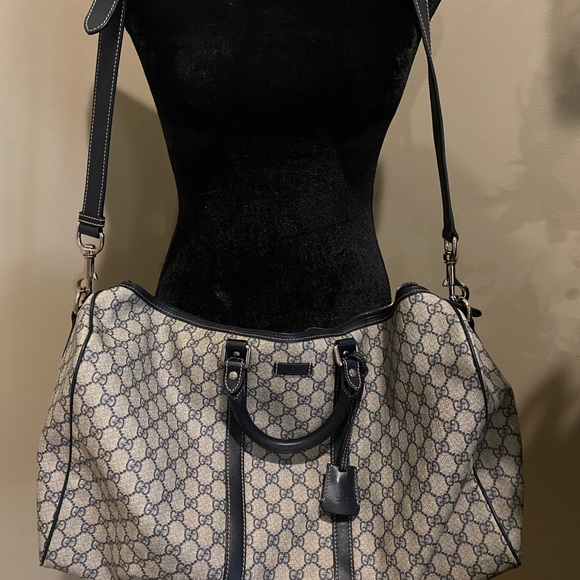 Gucci Handbags - Authentic Gucci overnight bag in Navy and tan w/ navy leather trim
